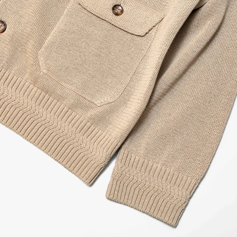 refinement-knitwear-essential-Close-up of the beige knit fabric showing texture, weave, and soft structure.
