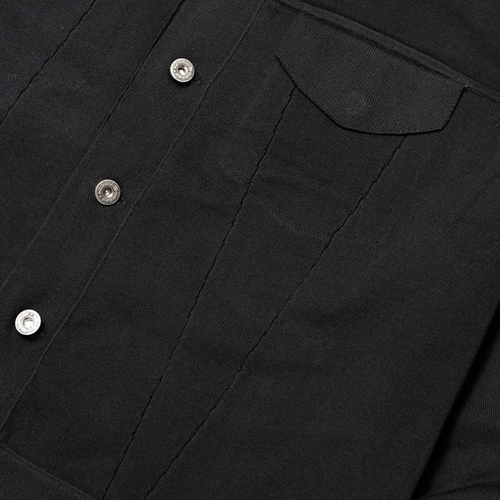 Close-up of the front pockets showing knit structure, pocket opening, and clean finishing.
