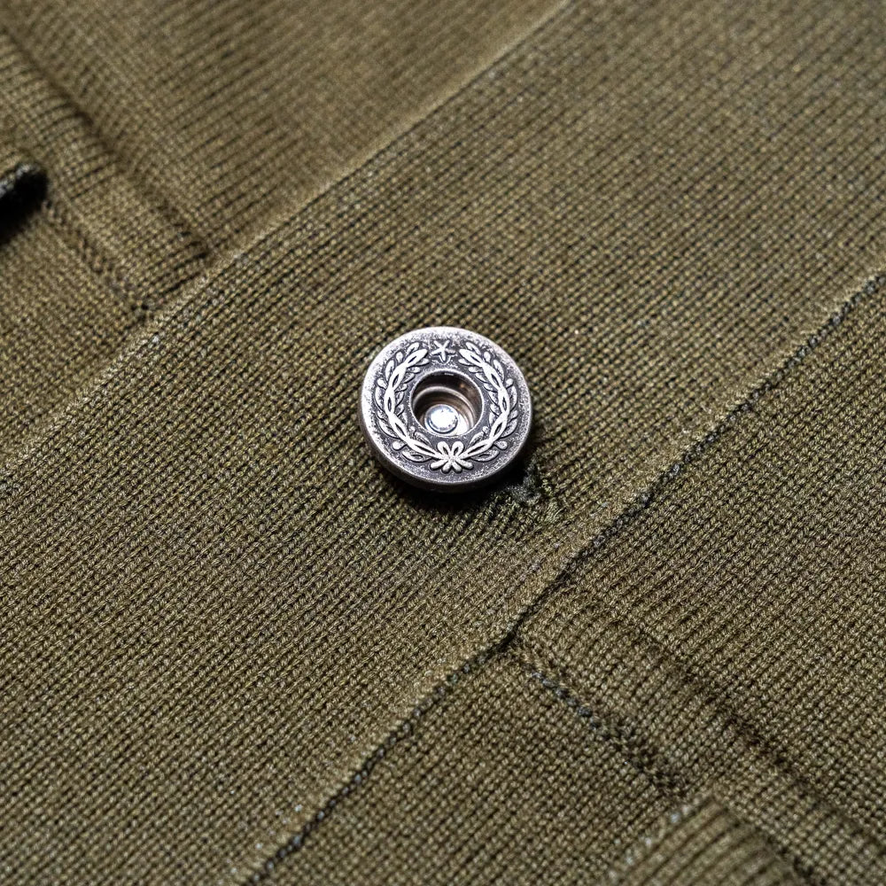 Close-up of the closure showing hardware detail, construction, and knit finishing.