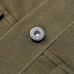 Close-up of the closure showing hardware detail, construction, and knit finishing.