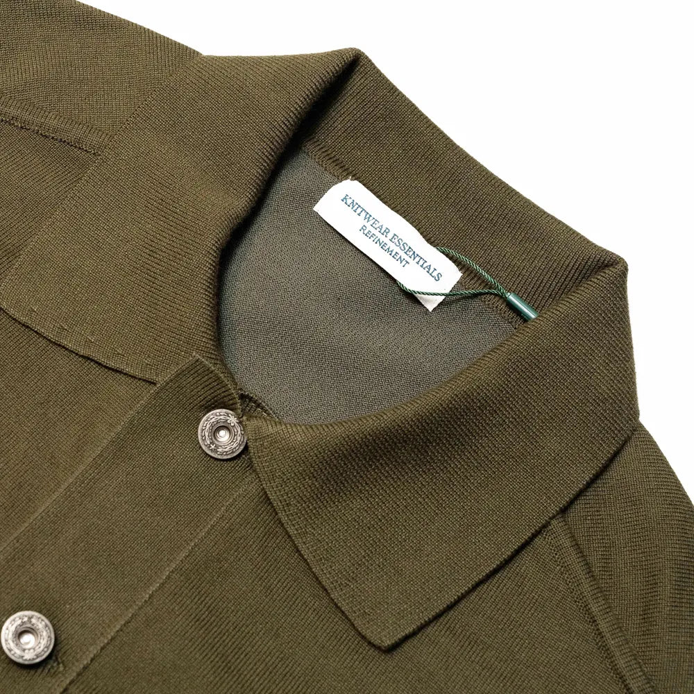 Close-up of the knit collar showing rib construction, stitching, and olive yarn texture.