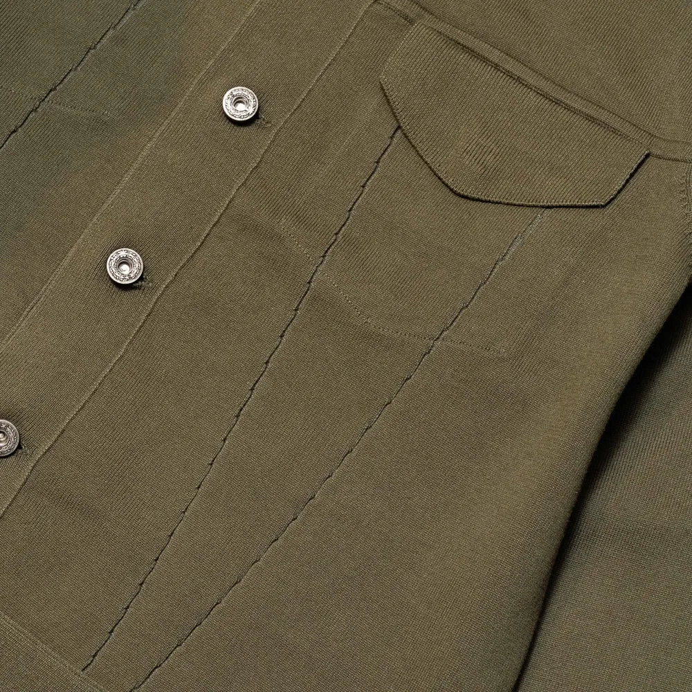 Close-up of the front pockets showing knit structure, pocket opening, and refined finishing.