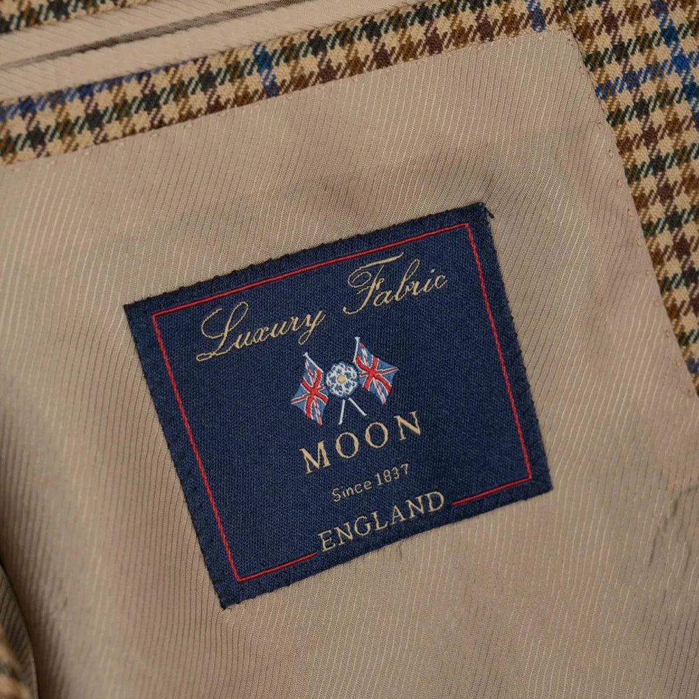 Close-up of the interior label on the RMJ-03 Gunclub Windowpane Jacket showing Refinement Made By Ring Jacket branding and inner lining construction.