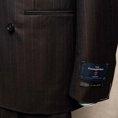 Close-up of the sleeve and hem area showing sleeve buttons, stitching, and clean finishing on the RMJ-04 Chalk Stripe Dark Brown Jacket.