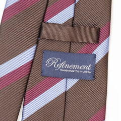 Close-up of the Refinement repp stripe neck tie showing the textured repp silk weave and brand label detail.