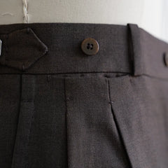 Close-up of the brown Crispaire high-twist fabric showing its texture, breathability, and crisp structure.