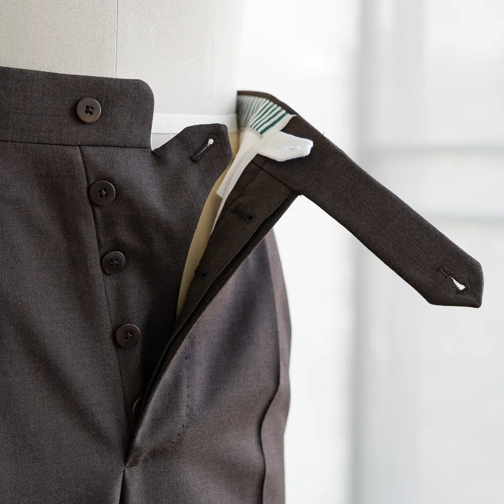 Close-up of the fly showing zipper, hook closure, and internal finishing.