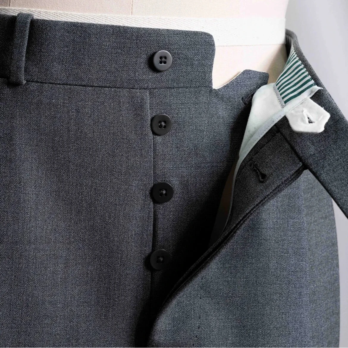 Close-up of the front pocket showing pocket curve, stitching, and clean sartorial finishing.