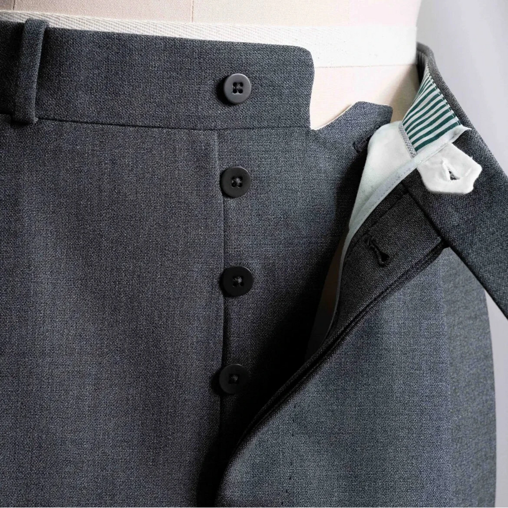 Close-up of the front pocket showing pocket curve, stitching, and clean sartorial finishing.