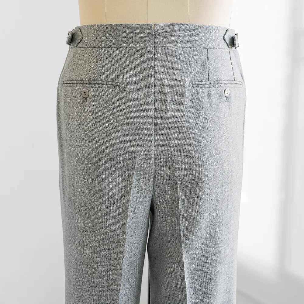 Back view highlighting the welt pockets, rear shaping, and smooth structure of the Airesco cloth.