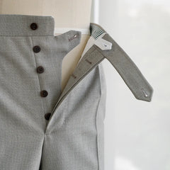 Close-up of the fly showing zipper, hook closure, and internal finishing.