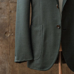 Close-up of the sleeve of the RMJ-03 Jacket Green by VBC showing button configuration, stitching, and sleeve finishing.
