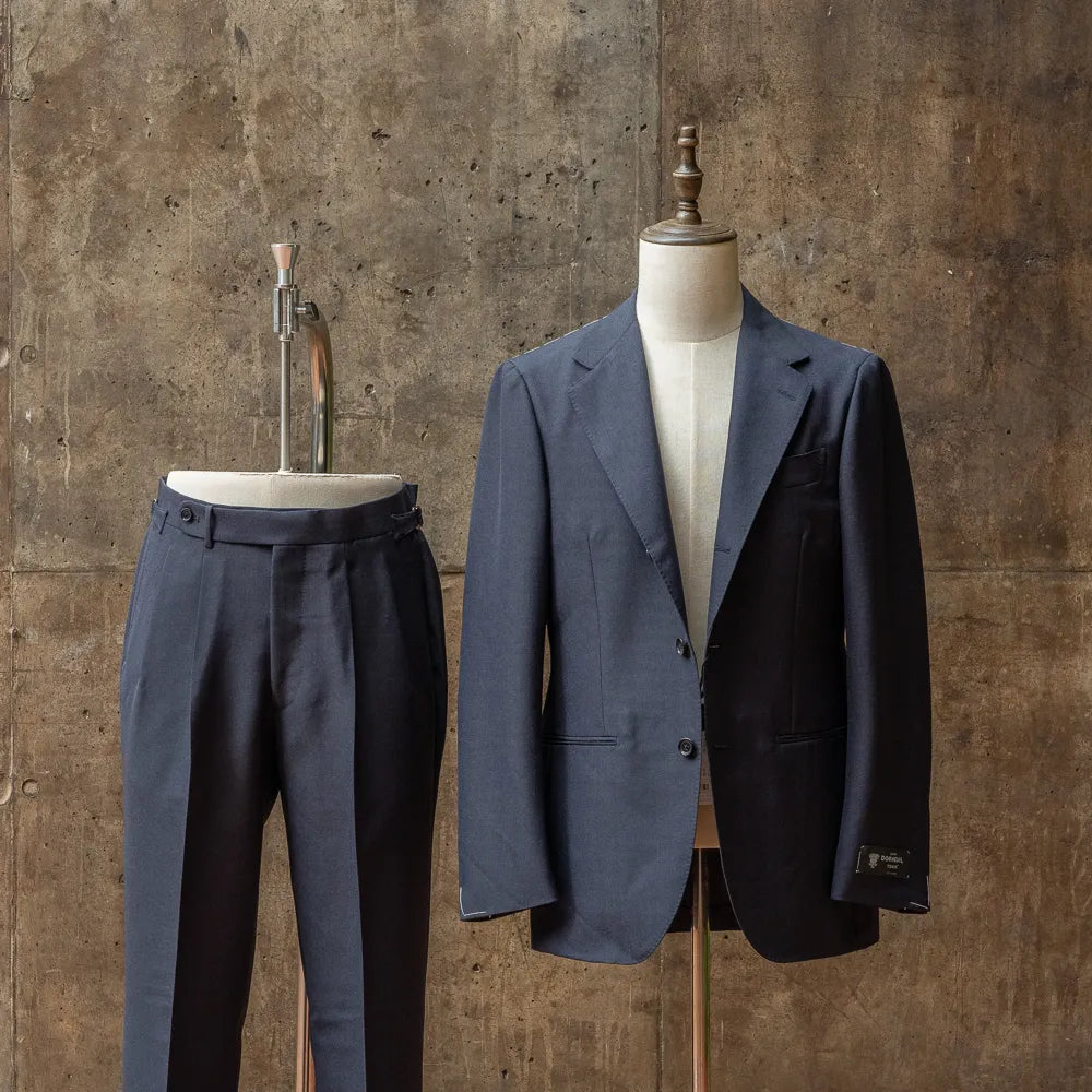 Full set view of the Refinement × Ring Jacket RMJ-03 Navy Suit by Dormeuil showing the jacket and trousers together with a refined tailored silhouette.