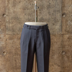 Front view of the trousers from the RMJ-03 Navy Suit by Dormeuil showing the pleats, clean leg line, and tailored fit.