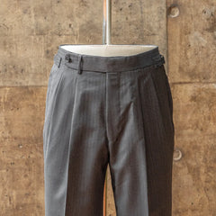 Front view of the trousers from the RMJ-04 Herringbone Charcoal Grey Suit showing pleats, tailored leg shape, and drape of the VBC fabric.