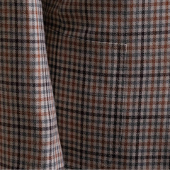 Close-up of the front pockets showing flap construction, stitching accuracy, and pattern alignment.