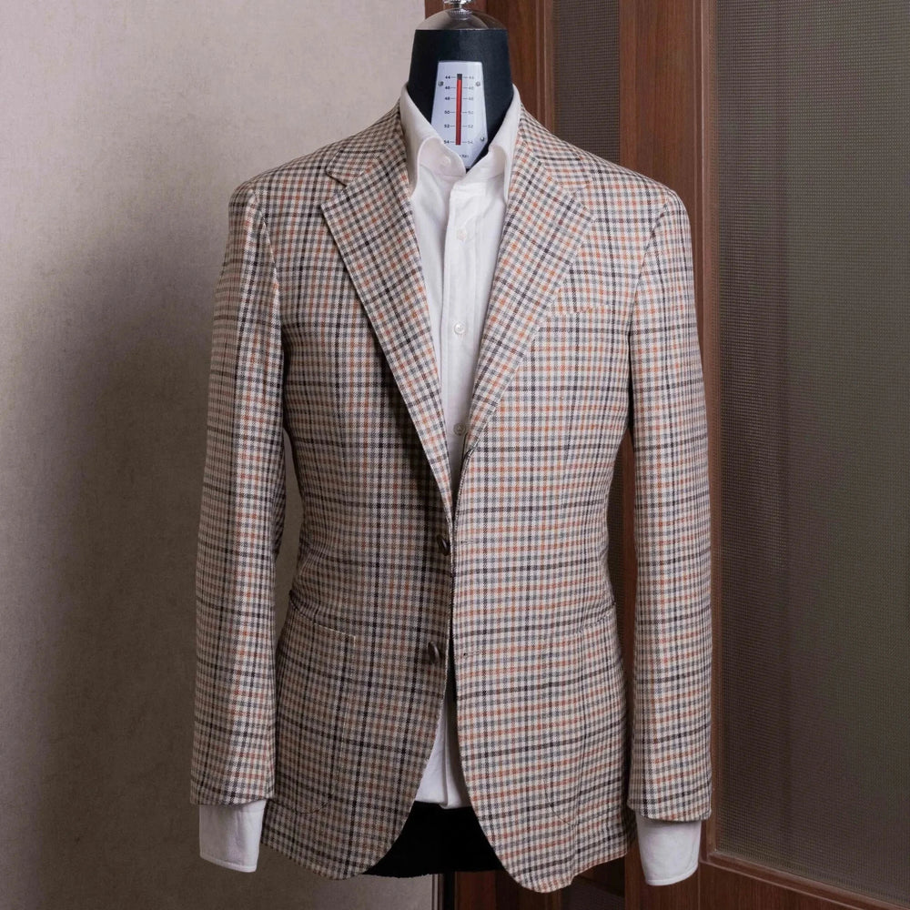 Front view of the Refinement Tailoring Rfmt-01 Sport Jacket Beige Gun Club by E. Thomas showing the classic sport coat silhouette, beige gun club pattern, and refined tailoring.