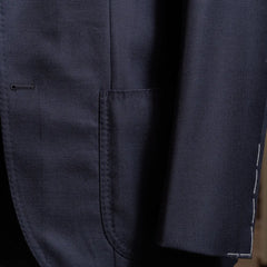 Close-up of the jacket front and hem showing natural drape and clean stitching.