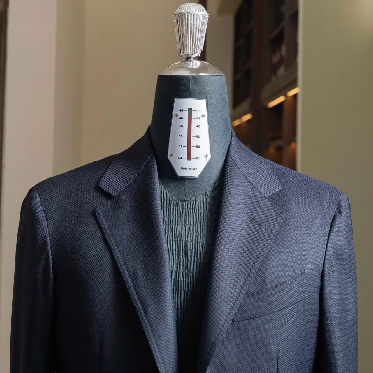 Close-up of the lapel and chest showing clean lapel roll and refined tailoring.