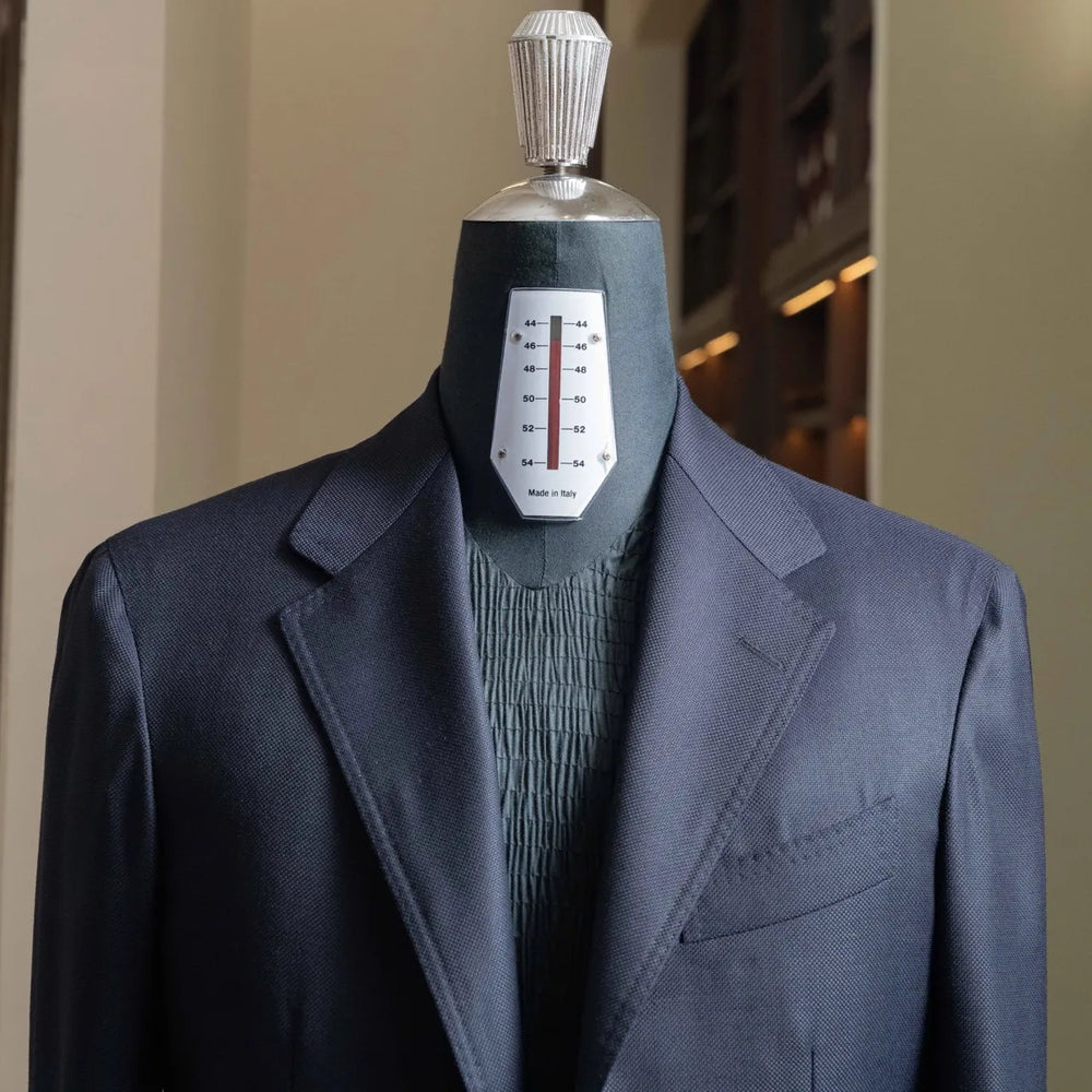 Close-up of the lapel and chest showing clean lapel roll and refined tailoring.