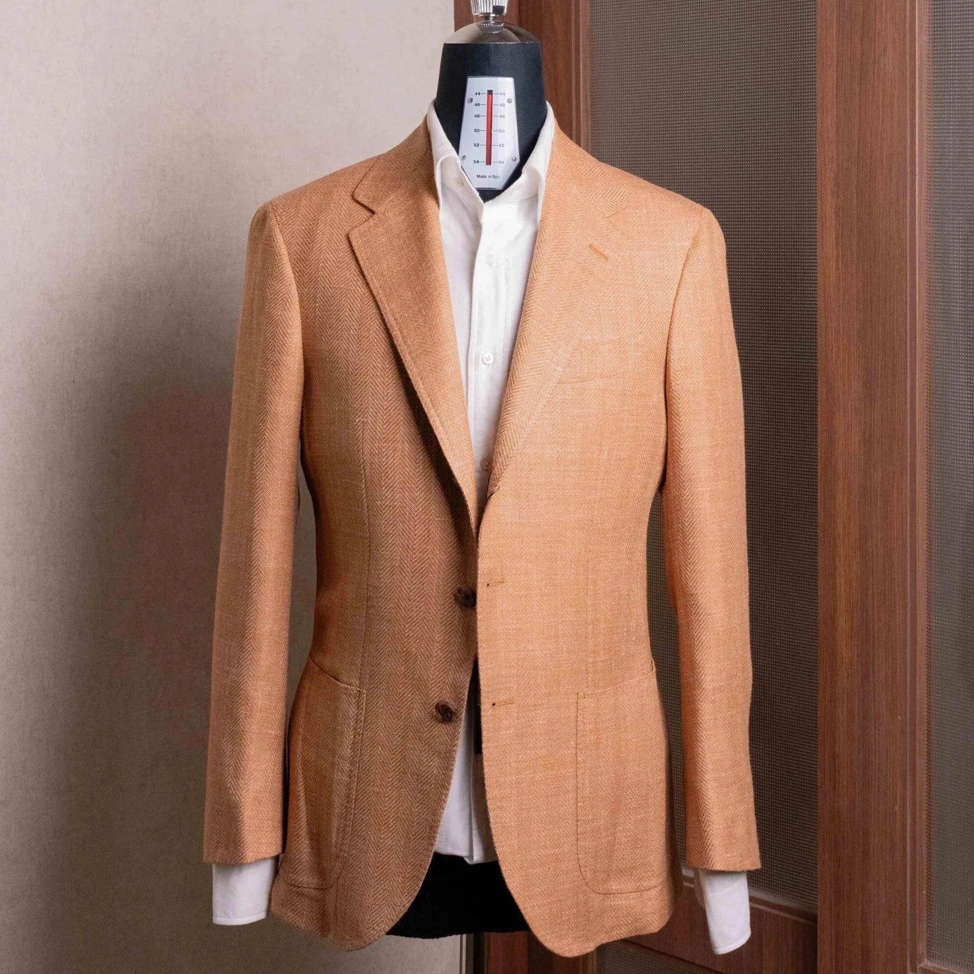 Front view of the Refinement Tailoring Rfmt-01 Sport Jacket Salmon Herringbone by E. Thomas showing the classic silhouette and warm salmon herringbone pattern.