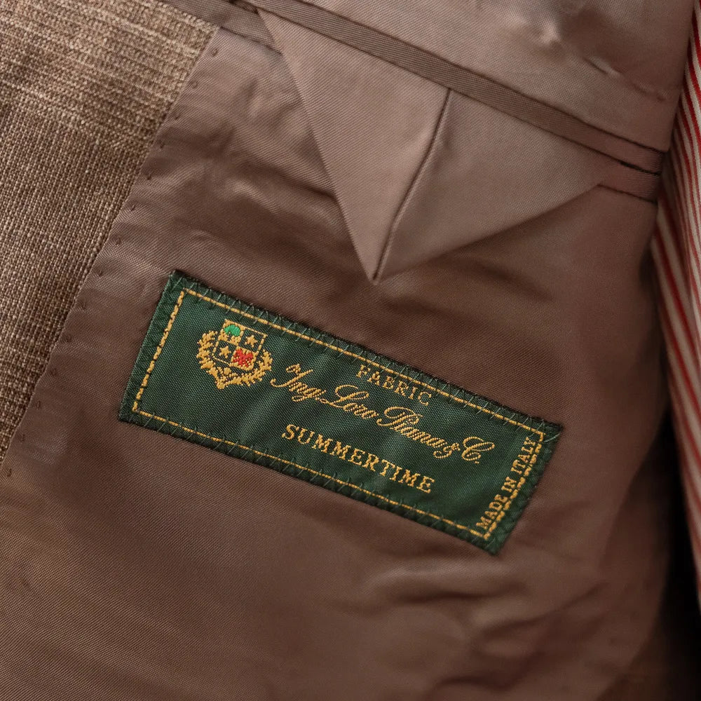 Interior close-up of the Loro Piana Summertime cloth label showing fabric origin and premium craftsmanship.