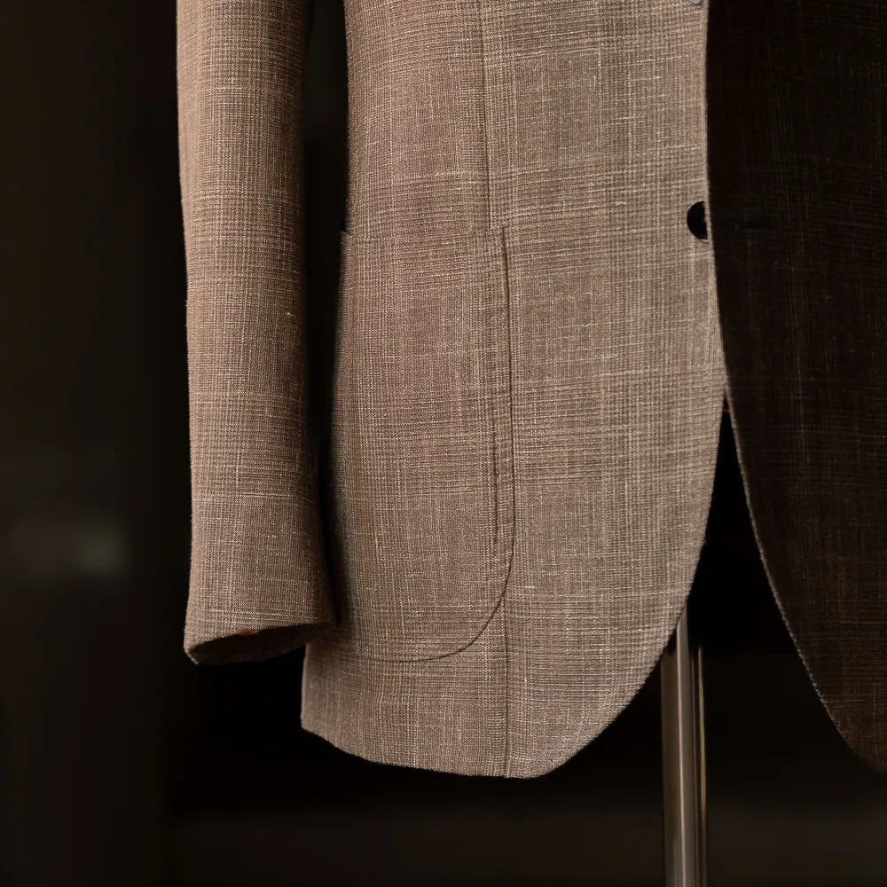 Side view showing sleeve finishing, button stance, and breathable Loro Piana Summertime fabric.