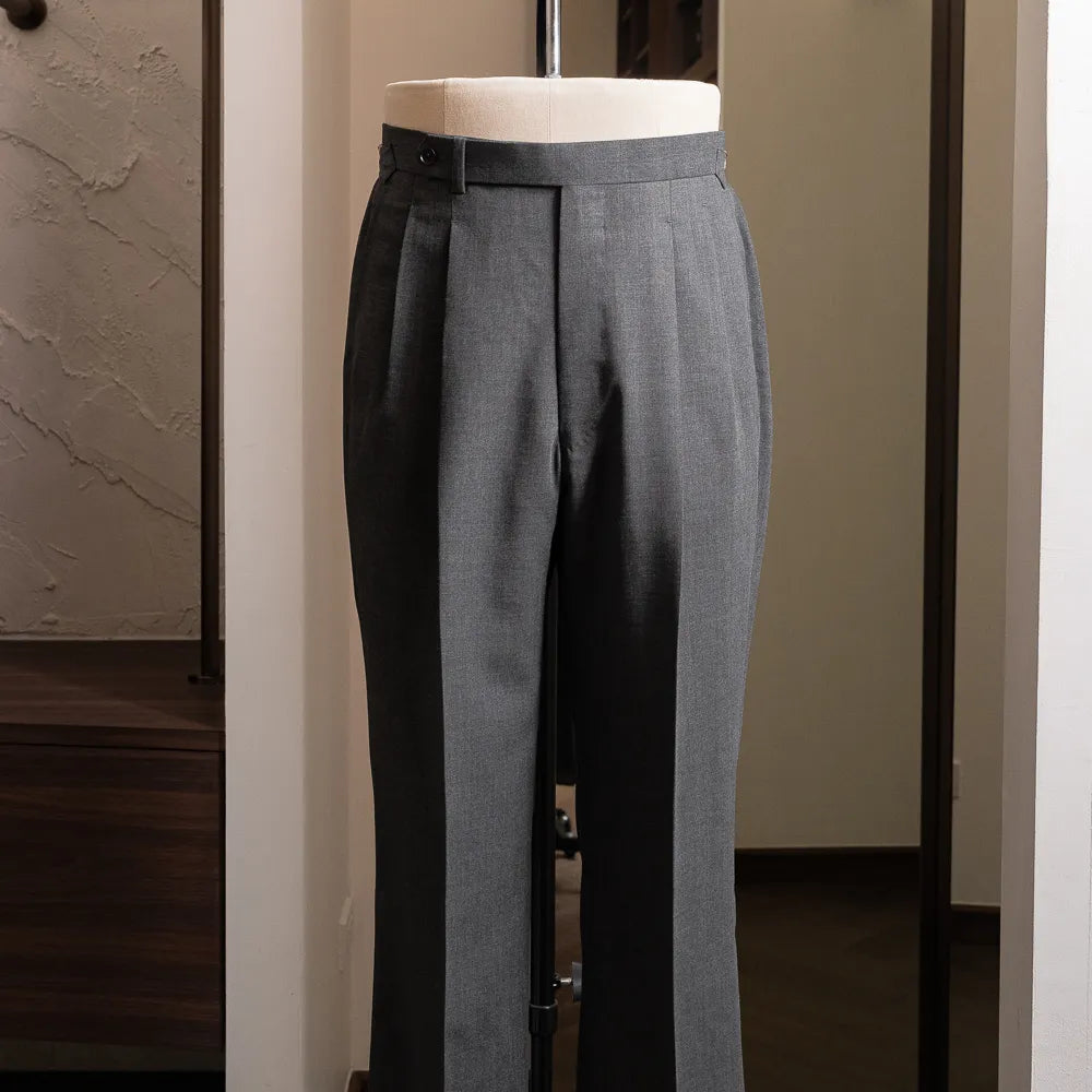 Front view of the grey trousers showing clean tailored silhouette.