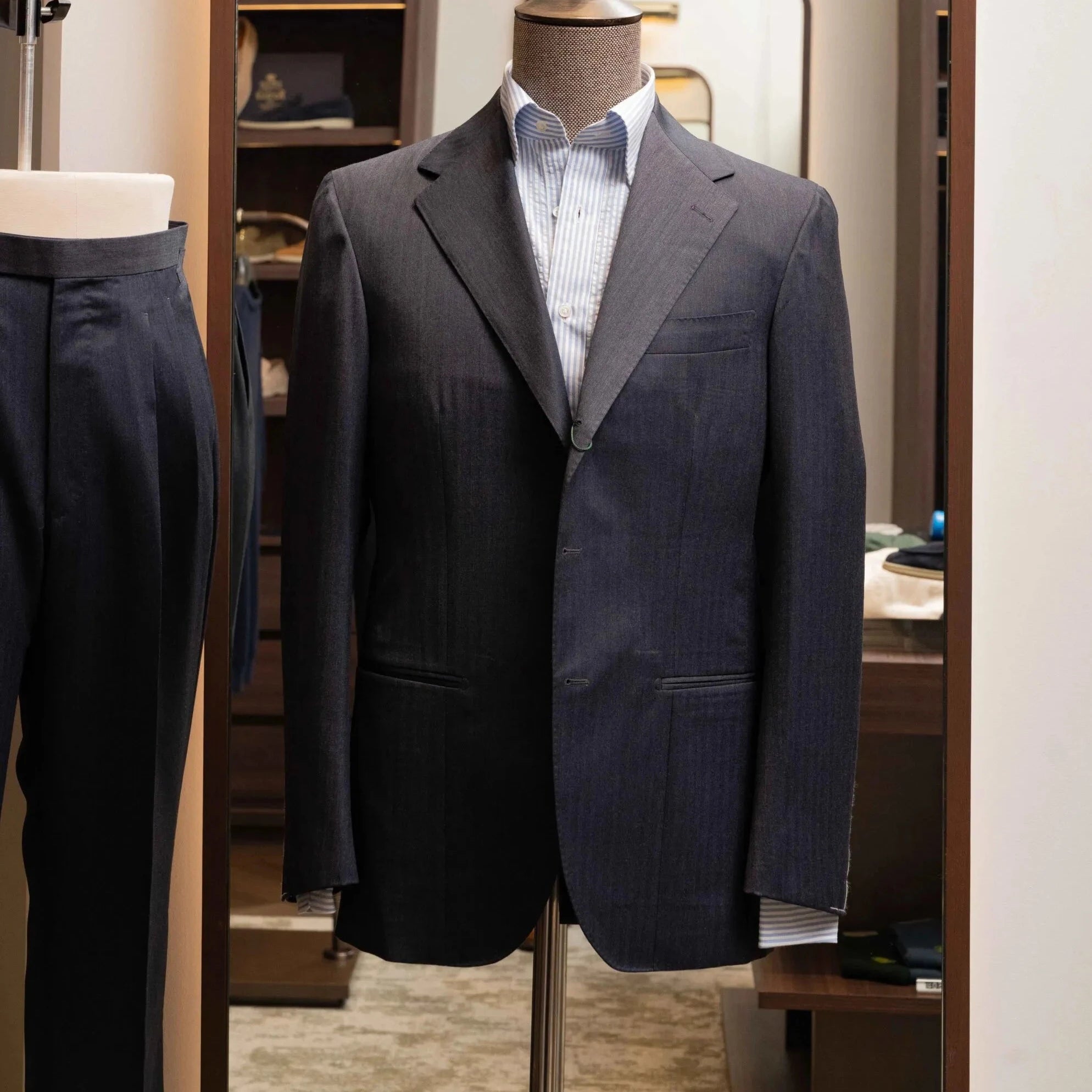 Front view of the Refinement Tailoring Rfmt-01 Suit Jacket in Herringbone Navy Grey by Savile Clifford showing the structured silhouette and refined herringbone pattern.