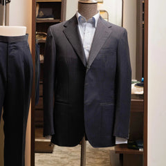 Front view of the Refinement Tailoring Rfmt-01 Suit Jacket in Herringbone Navy Grey by Savile Clifford showing the structured silhouette and refined herringbone pattern.