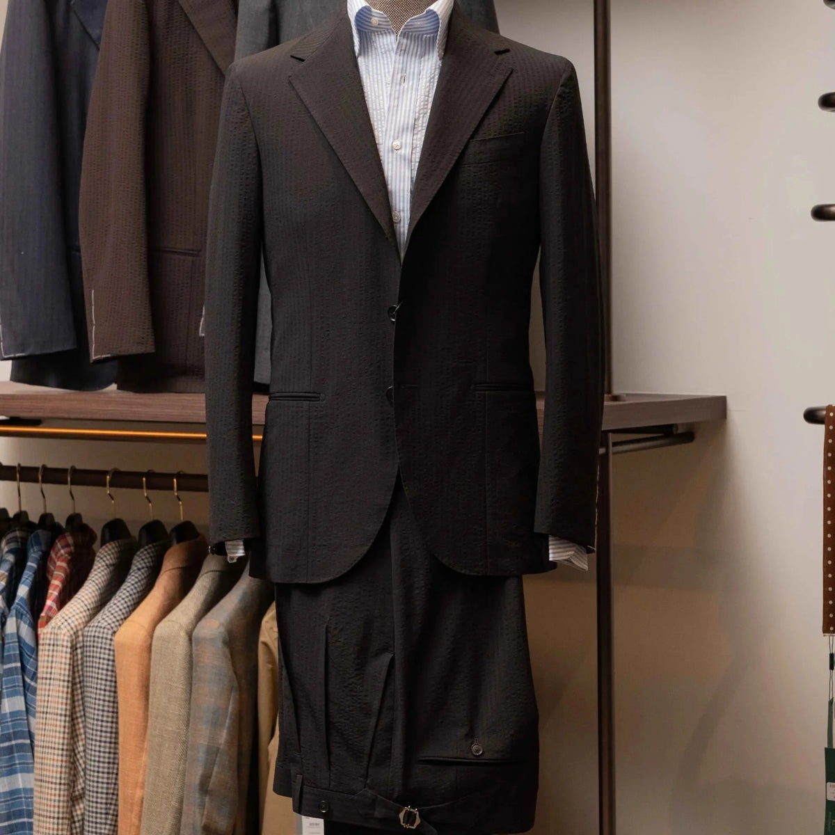 Front view of the Refinement Tailoring Rfmt-01 Suit Jacket Seersucker Black by Fratelli Tallia di Delfino showing the lightweight silhouette and textured black seersucker fabric.