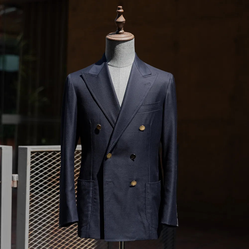 Full front view of the Refinement Tailoring Rfmt-02 double-breasted blazer in navy by Loro Piana showing structured silhouette and peak lapels.
