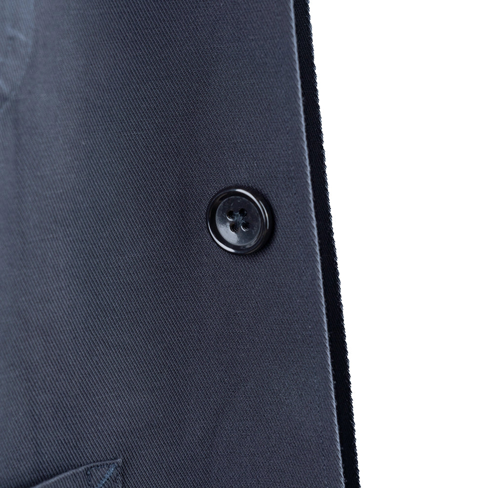Close-up of the front buttons showing hardware detail, button shape, and placket construction.