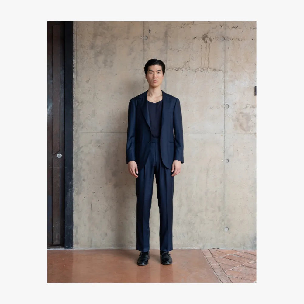 Full body view of RMJ-03 navy single breasted herringbone suit by Ring Jacket made with VBC fabric