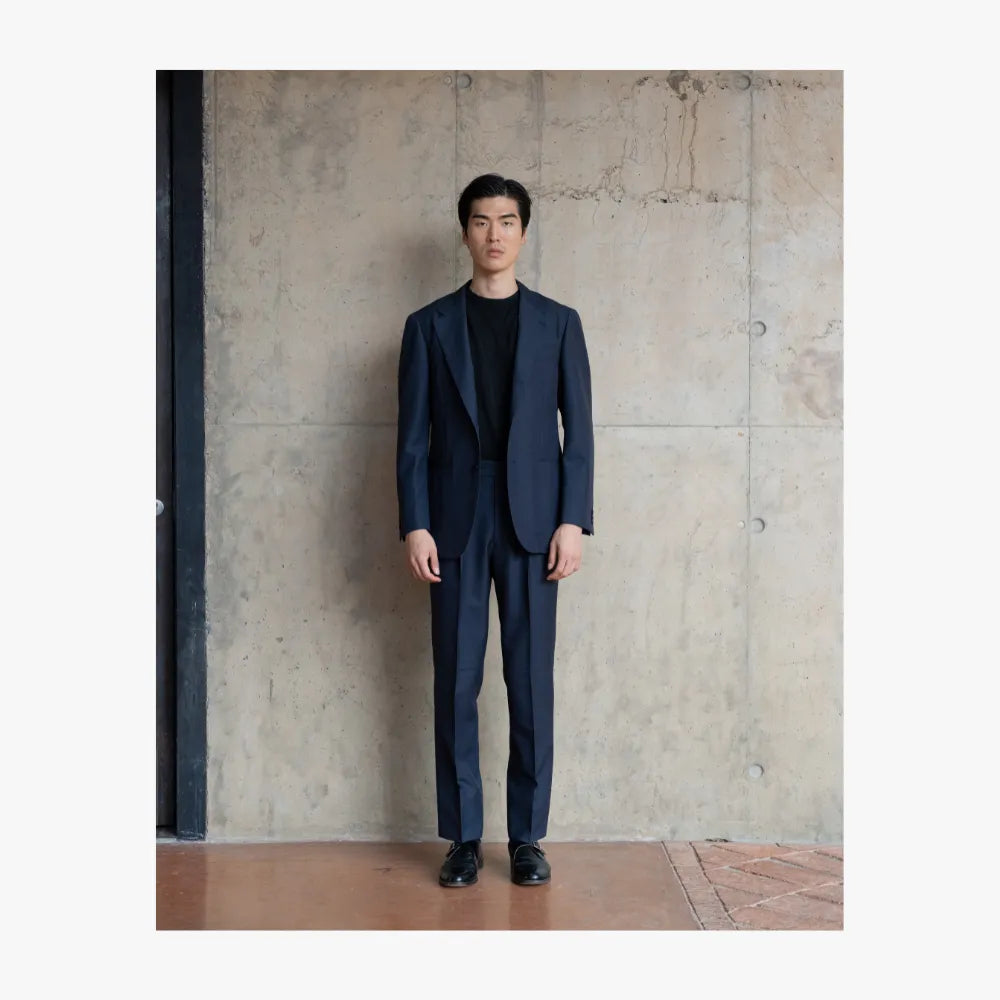 Full body view of RMJ-03 navy single breasted suit by Ring Jacket crafted from Doemueil fabric