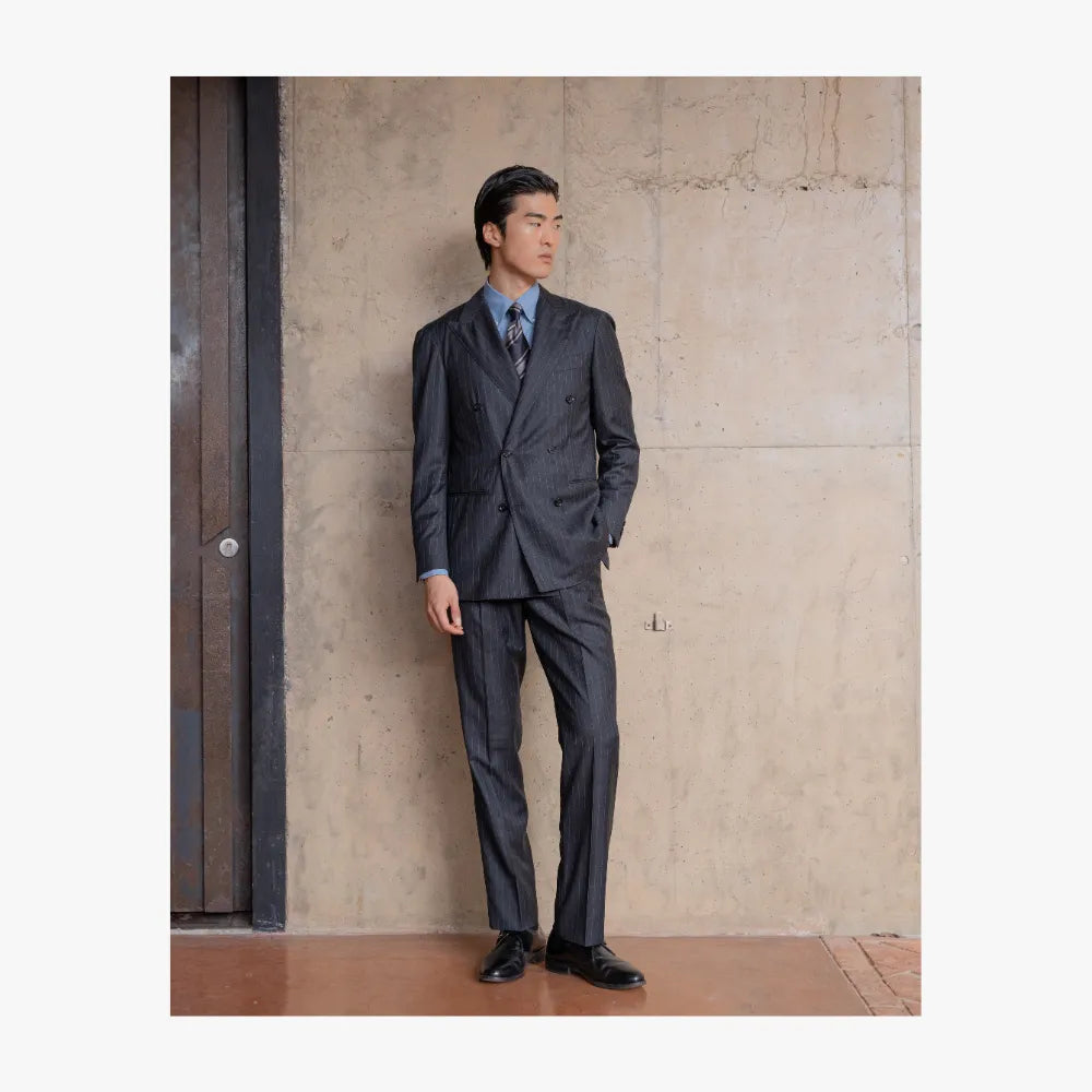 Full body view of RMJ-04 charcoal grey chalkstripe double breasted suit by Ring Jacket made with VBC fabric