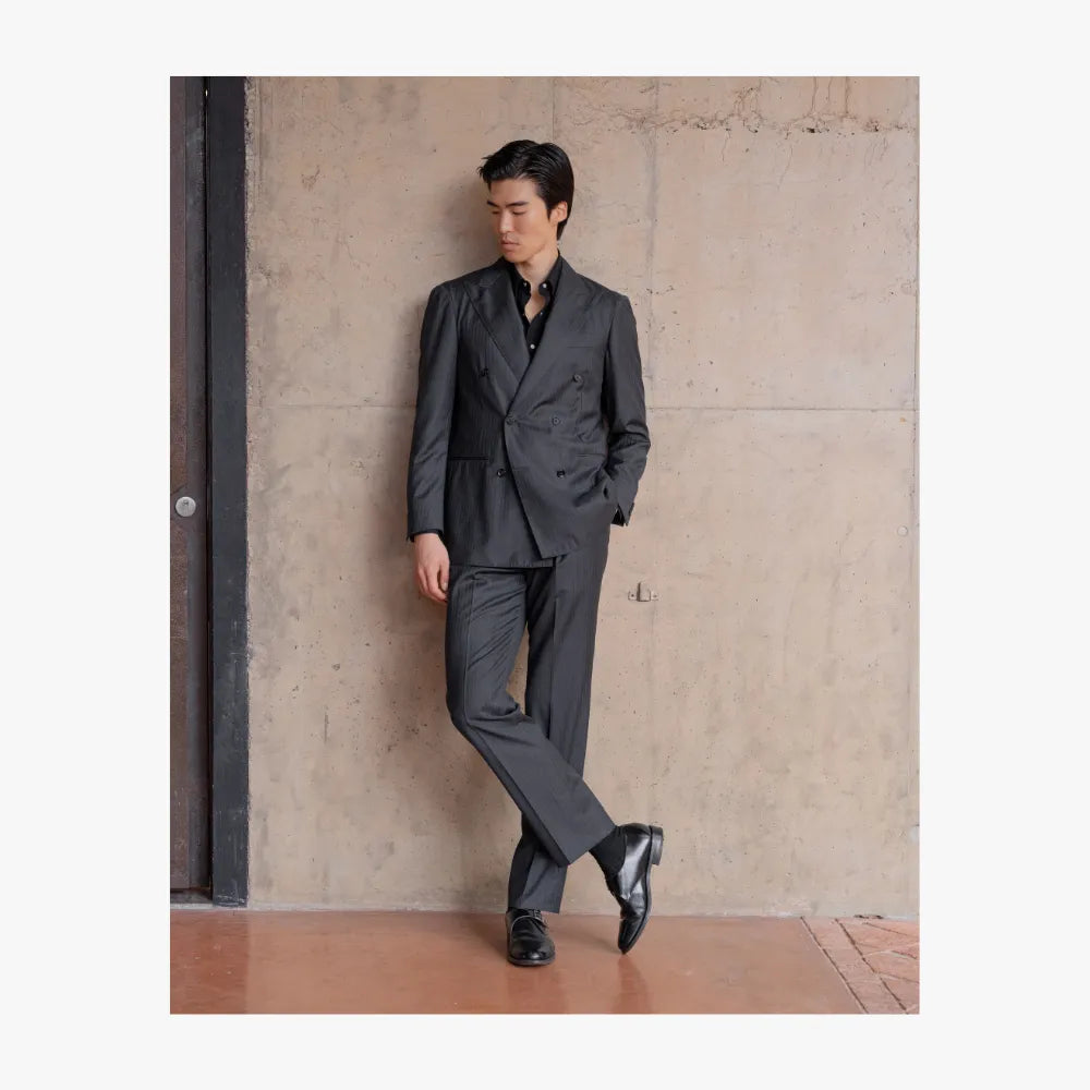 Full body view of RMJ-04 charcoal grey double breasted suit by Ring Jacket made with VBC herringbone fabric