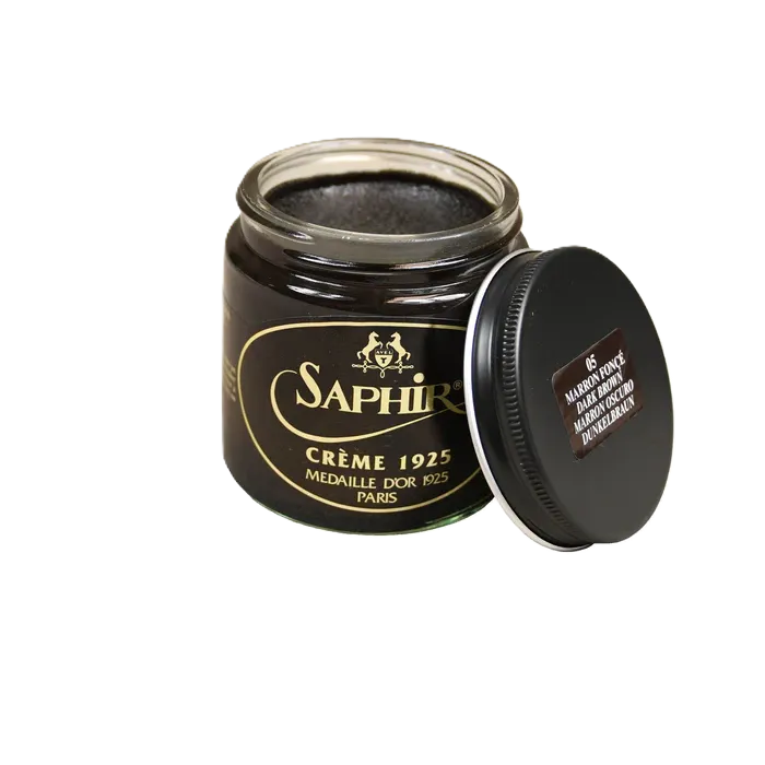 Front view of Saphir Creme 1925 in Black, showing the premium glass jar and rich black cream color for deep leather nourishment.