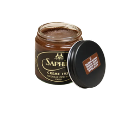 Front view of Saphir Creme 1925 in Medium Brown, featuring the glass jar and mid-brown cream tone designed for conditioning and color restoration.