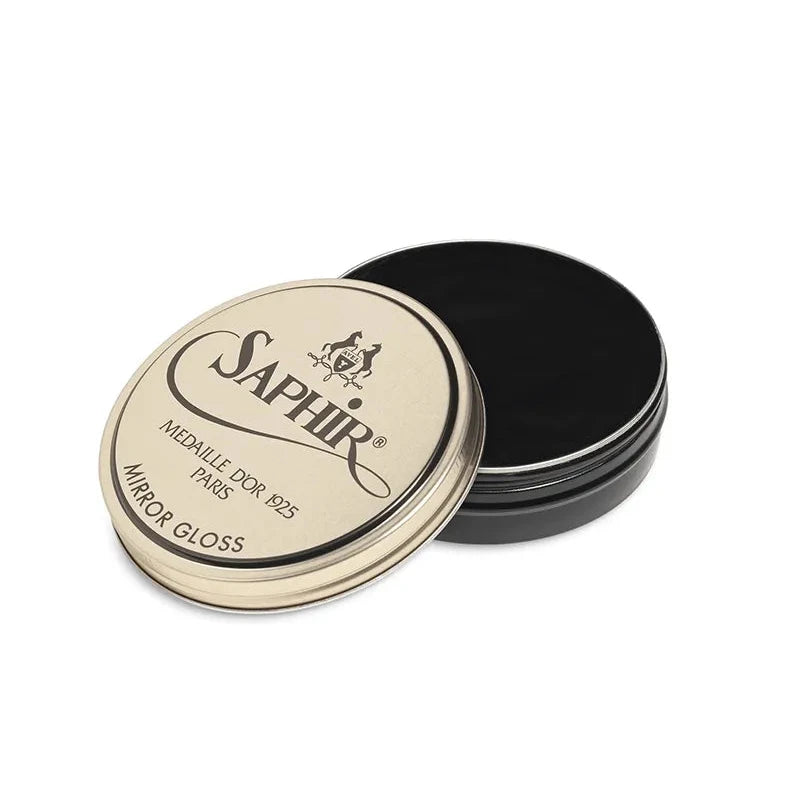 Front view of Saphir Mirror Gloss showing the iconic round metal tin and classic navy-and-gold label.