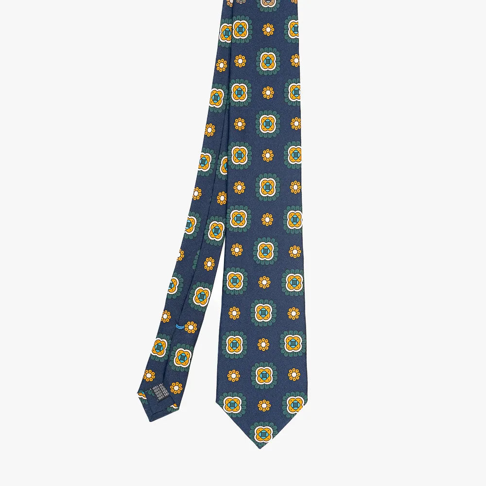 Full view of the Stefano Cau floral tie in navy showing the refined floral pattern and elegant proportions.