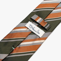 Close-up of the back side of the Stefano Cau regimental tie showing the brand label, hand-finished stitching, and clean construction.