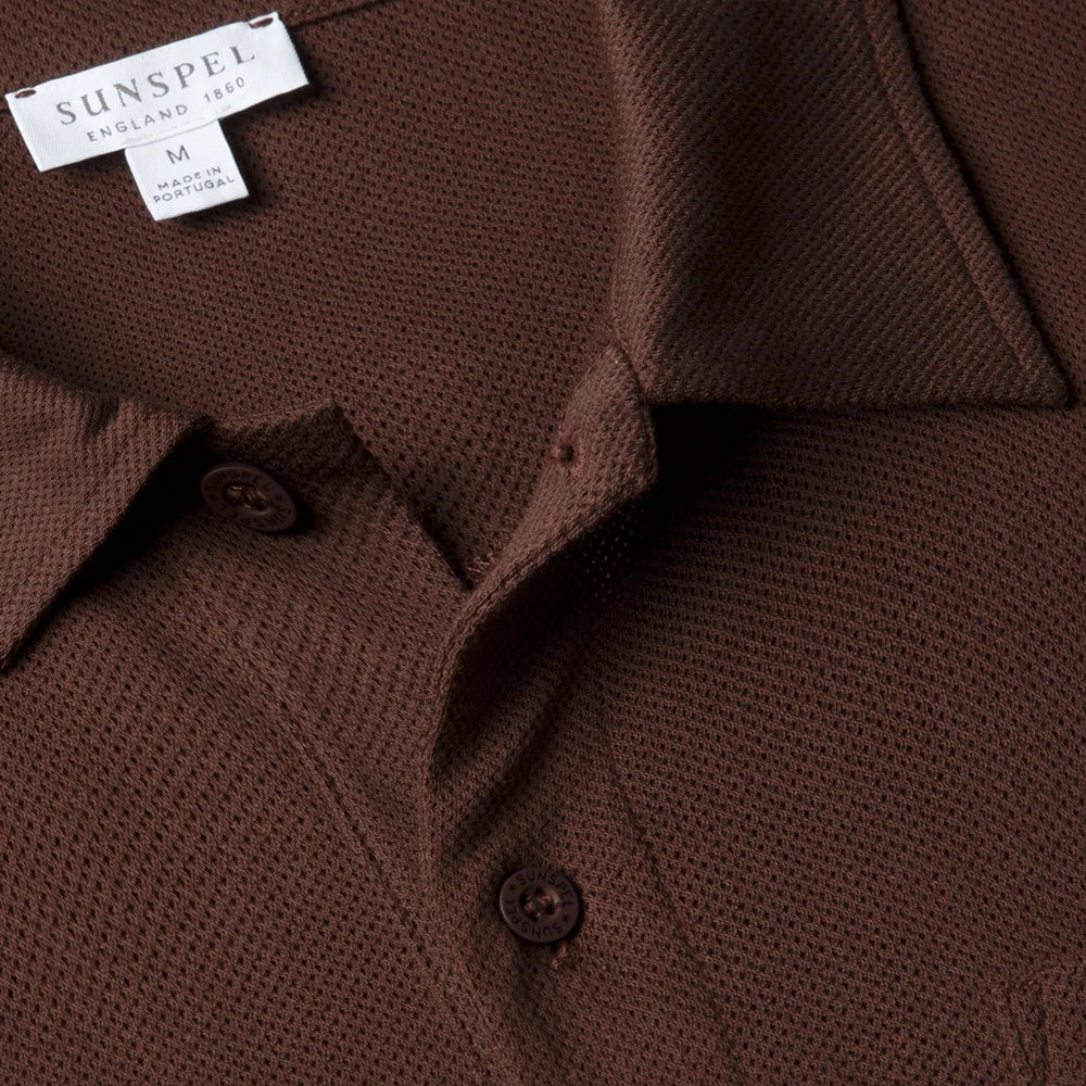 Close-up of the polo collar highlighting the structured collar and button placket detail.