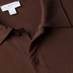 Close-up of the polo collar highlighting the structured collar and button placket detail.