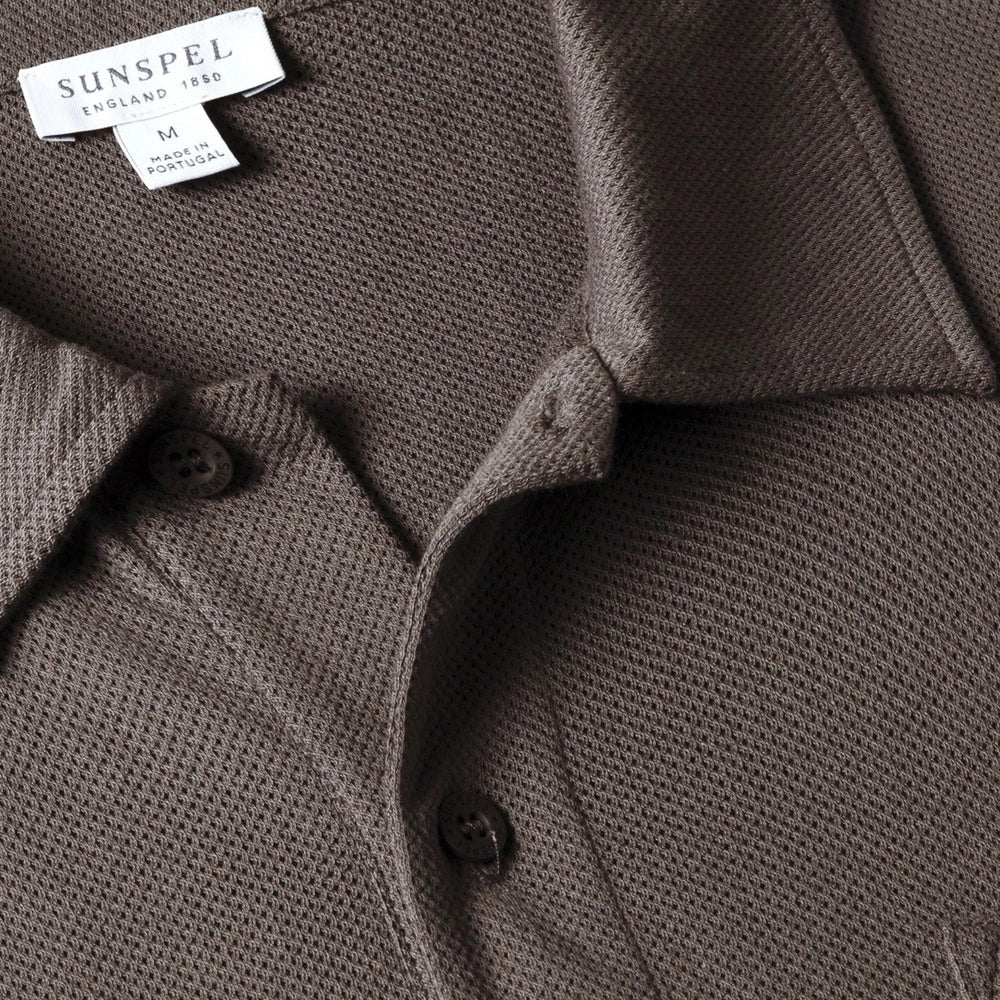 Close-up of the polo collar highlighting the structured collar and button placket detail.