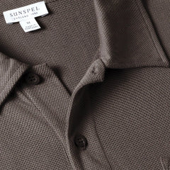 Close-up of the polo collar highlighting the structured collar and button placket detail.
