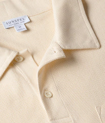 Close-up of the collar of the Sunspel Riviera Polo Shirt Buttermilk showing the breathable mesh cotton and refined neckline.