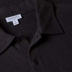 Close-up of the collar of the Sunspel Riviera Polo Shirt Charcoal showing the breathable mesh cotton and refined neckline.
