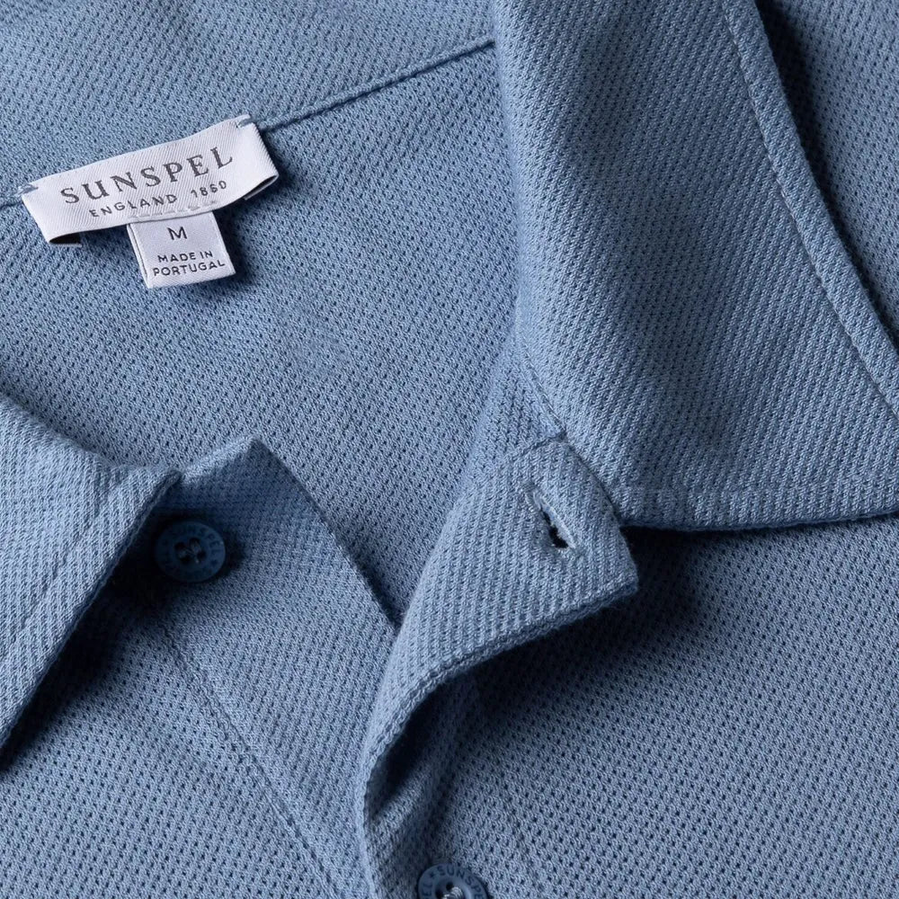 Close-up of the collar of the Sunspel Riviera Polo Shirt Cornflower showing the breathable mesh cotton and refined neckline.