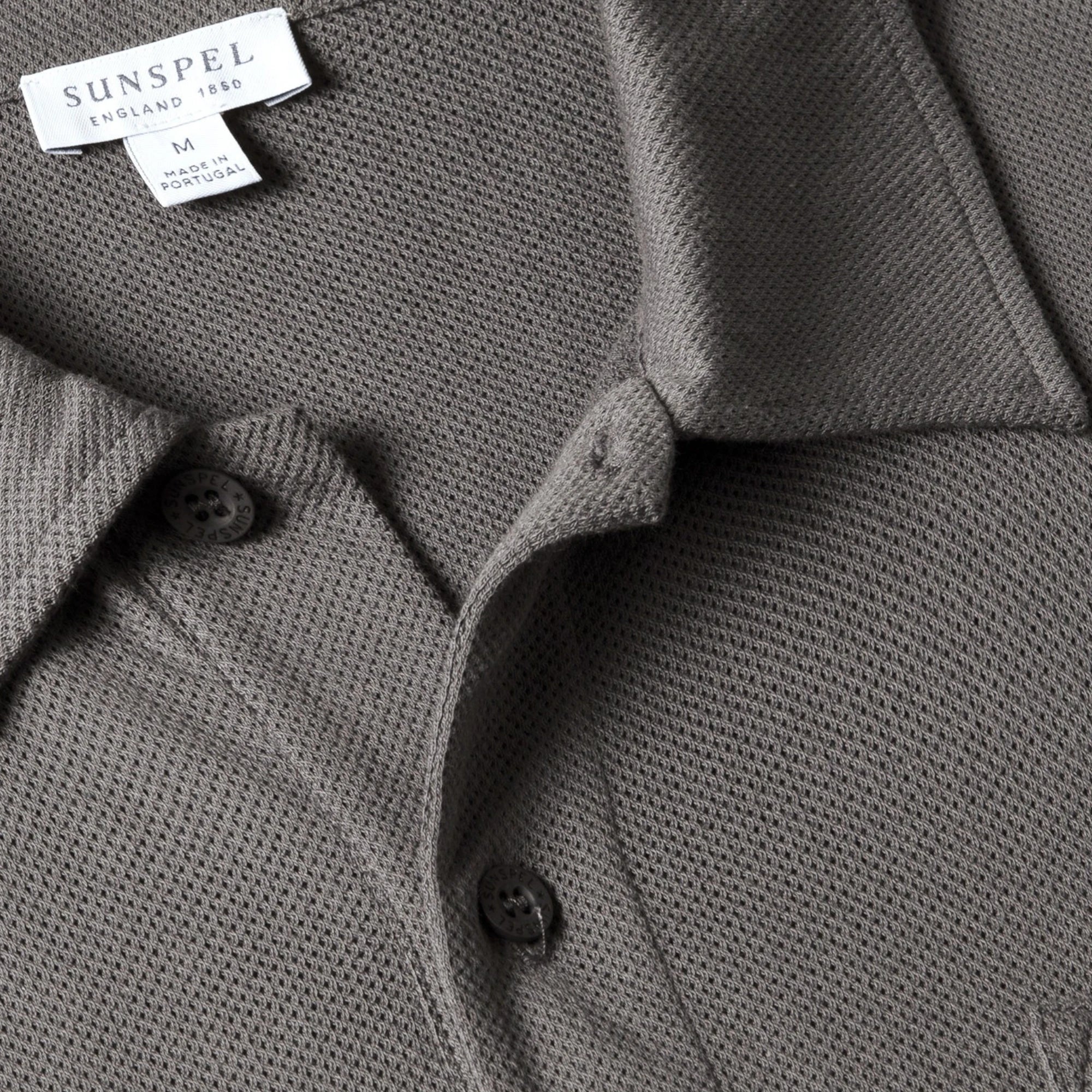 Close-up of the polo collar highlighting the structured collar and button placket detail.